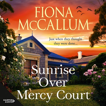 Book cover SUNRISE OVER MERCY COURT by Fiona McCallum showing at top an orange sky and below a modern traditional style bluestone house with green lawn and pale pink roses out the front.